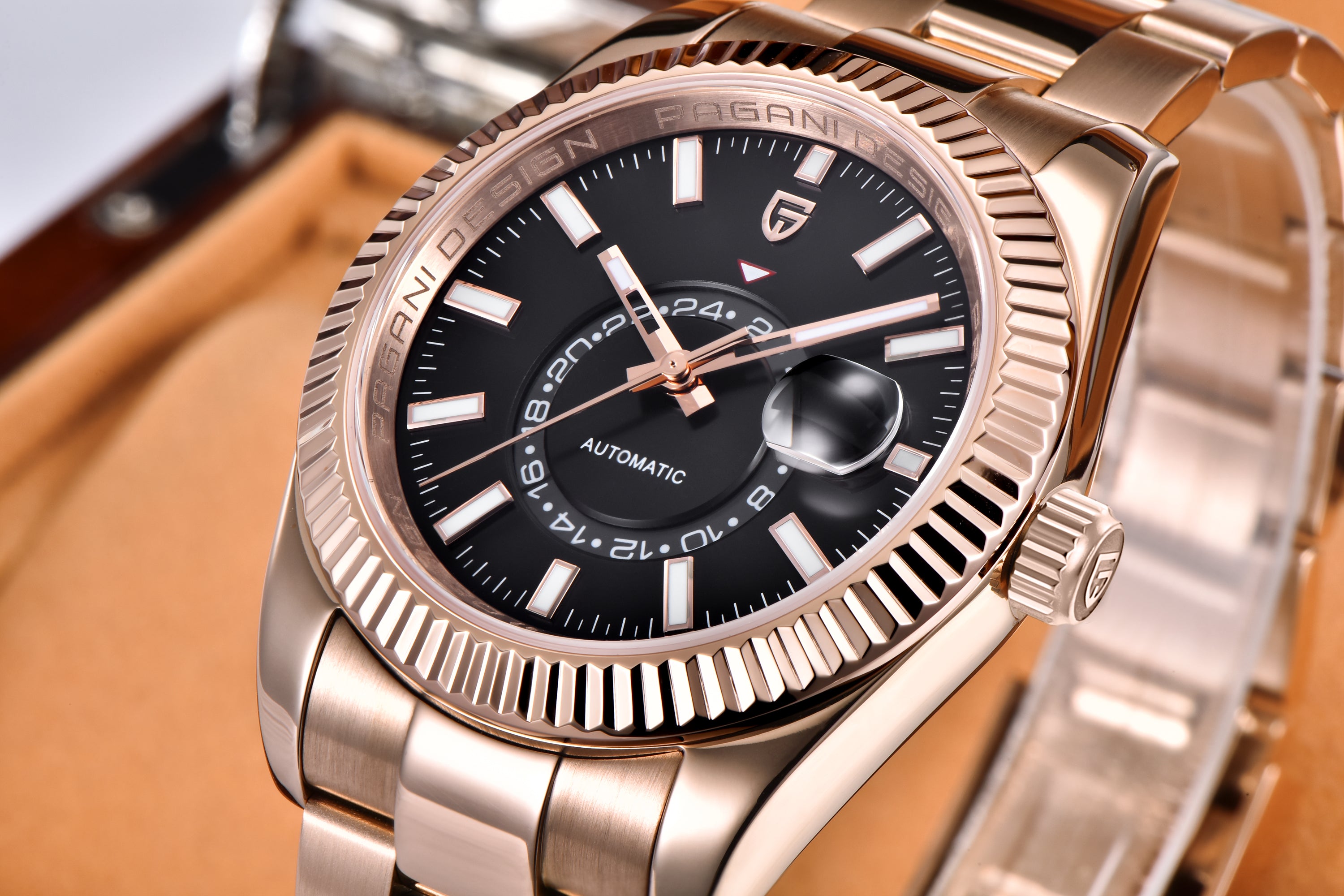 Pagani Design PD-1888 rose gold automatic watch with black dial, close-up showing fluted bezel and cyclops date